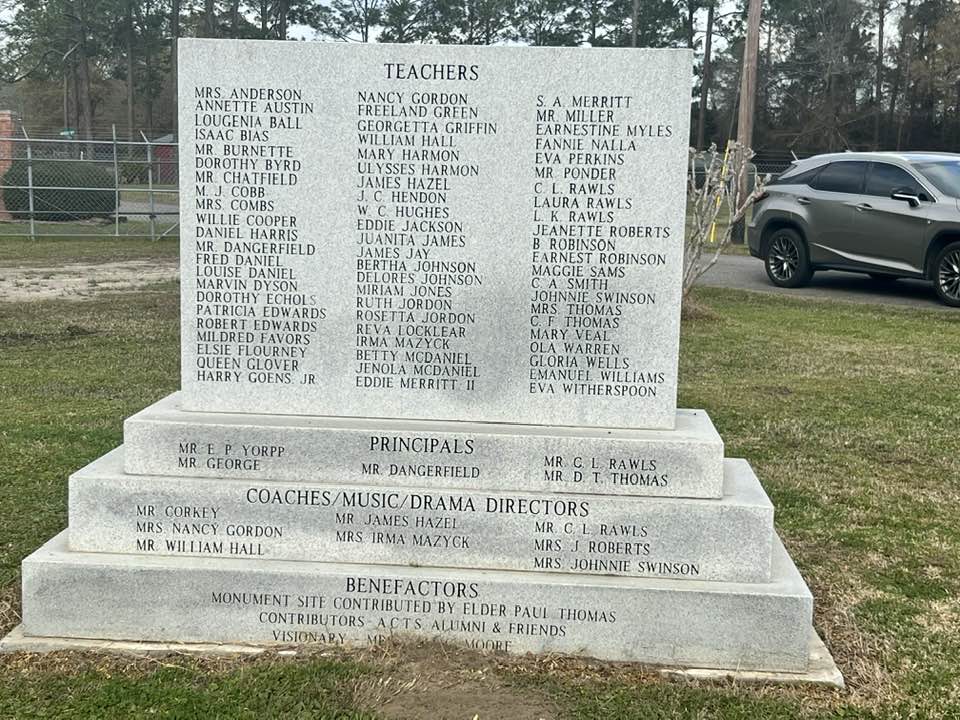 The back of the monument. Engraved are the names of the teachers, principals, coaches, music and drama directors and benefactors.  