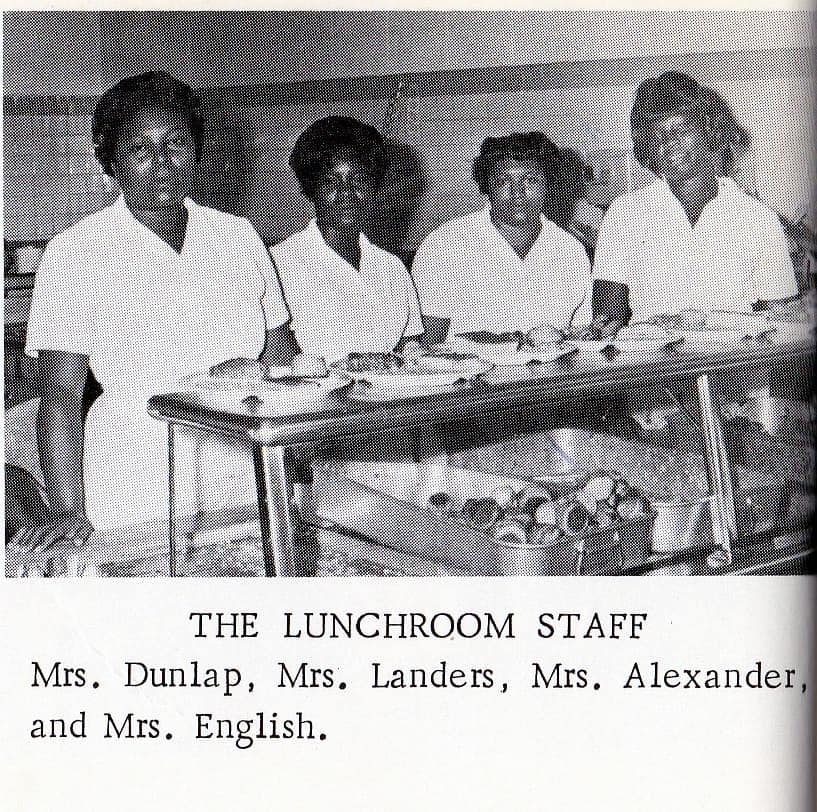 Lunch Room staff members pose in the lunchroom.